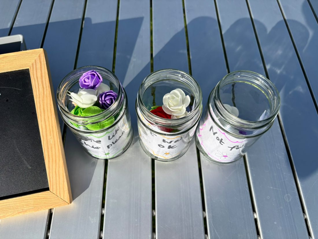 Flower tokens in three feedback jars