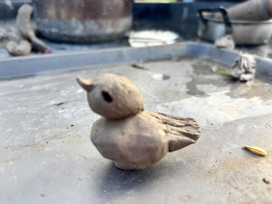 Small clay bird created during the event