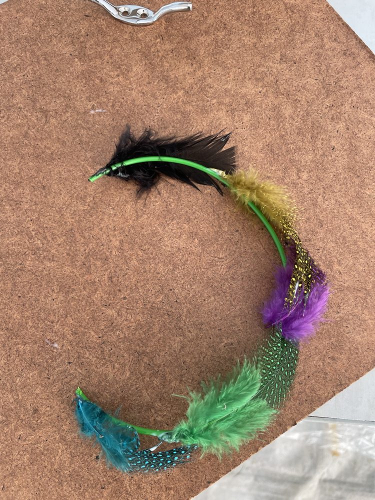 Creative artwork made with feathers and colour